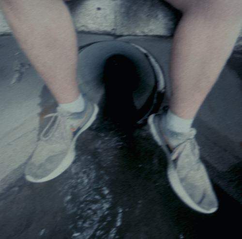 Feet over a well